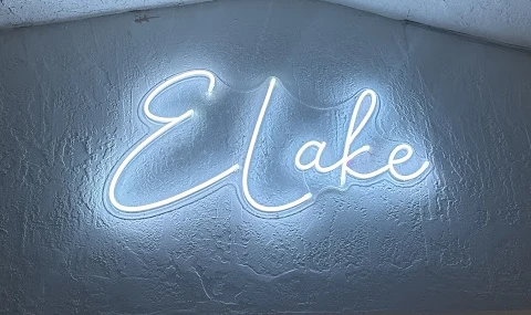 Elake white script text neon installed by Miami Neons